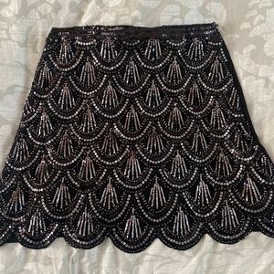 Sequin, scalloped front black mini skirt